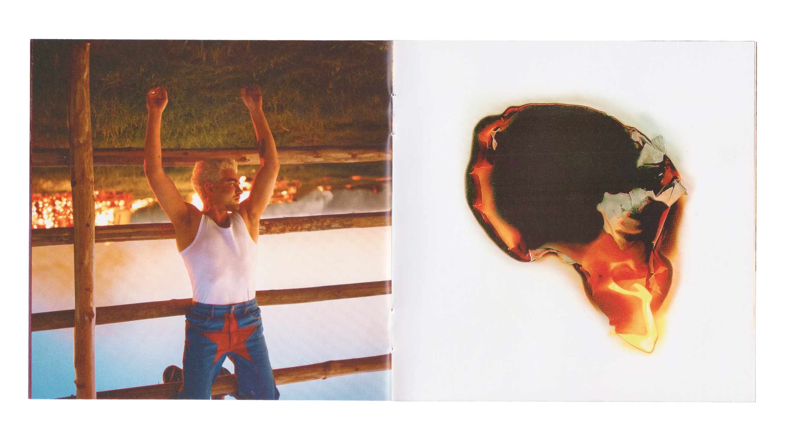 CD booklet spread — a portrait on a ranch fence at night beside a burning circular artwork